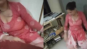 Maid reveals her curves while tidying up