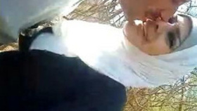 Arab woman pleasuring herself and giving oral outdoors