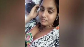 A South Asian woman reveals her cleavage during a chat