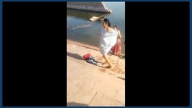 Indian village women bathe outdoors