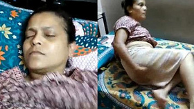 Indian homemaker indulges in self-pleasure by licking, fingering, and squeezing her breasts