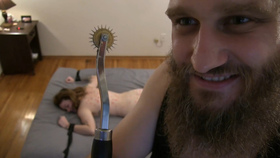 Harsh dominator uses Wartenberg wheel on submissive