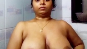 Indian wife flaunting her large breasts