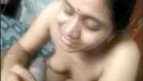 A Telugu housewife receives oral and vaginal penetration in a heated video