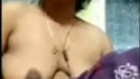 Indian wife's seductive performance on camera in a village setting