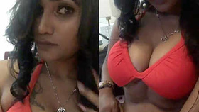 A busty Indian model flaunts her curves in a swimsuit