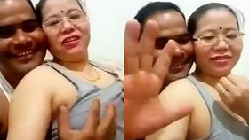 Nepali auntie records herself getting her breasts fondled by her husband with explicit audio