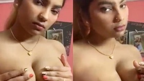 A seductive Desi girlfriend flaunts her breasts in a brief video